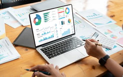 Business team analyzing financial data for the fulfillment industry report