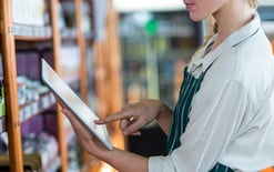 Female staff member using tablet for the best 3PL for ecommerce blog