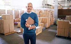 Man in warehouse discusses how to choose a 3PL provider
