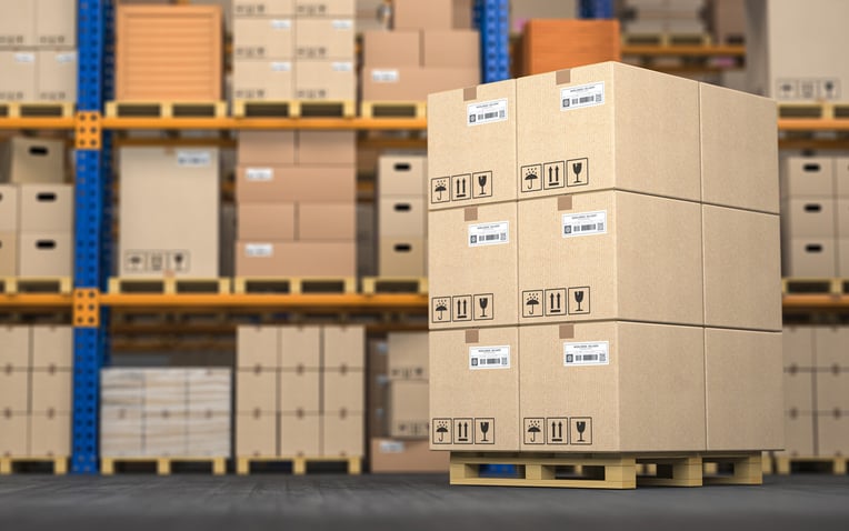 Photo of warehouse with cardboard boxes on pallet for challenges in order fulfillment process blog