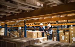 Managers working in a warehouse for the fulfillment center pricing guide 2025