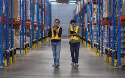 Distribution workers walk through a warehouse for best 3PL companies in the USA