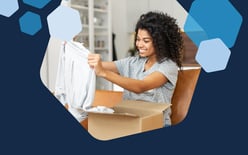 woman removing clothes from package