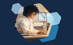 woman writing on laptop computer