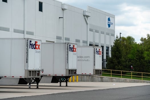 fedex trailers parked at cart.com loading dock