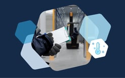 person with gloves and clipboard in cold storage warehousing facility, hexagon with temperature symbol showing cold