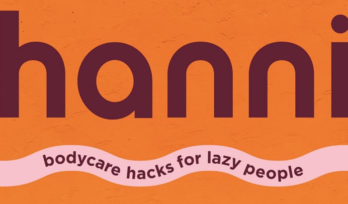 hanni logo with tagline, bodycare hacks for lazy people, on orange background