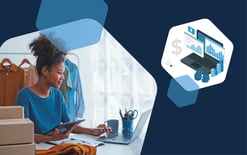 woman on tablet and laptop with clothes and boxes near her, representing the pros and cons of using a marketplace agency to help you navigate the complexities of Amazon Marketplace and Walmart Marketplace