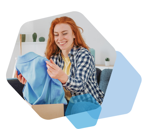 Customer receiving shirt from apparel fulfillment service