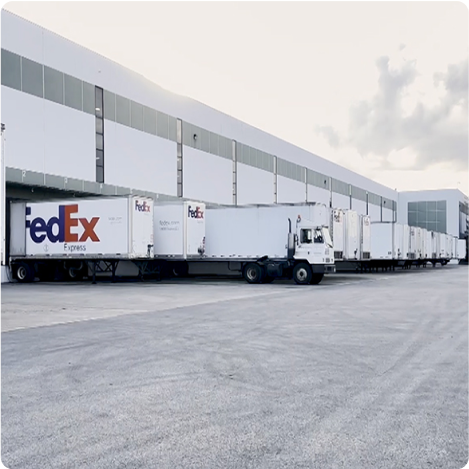 trucks in loading docks at a Cart.com warehouse